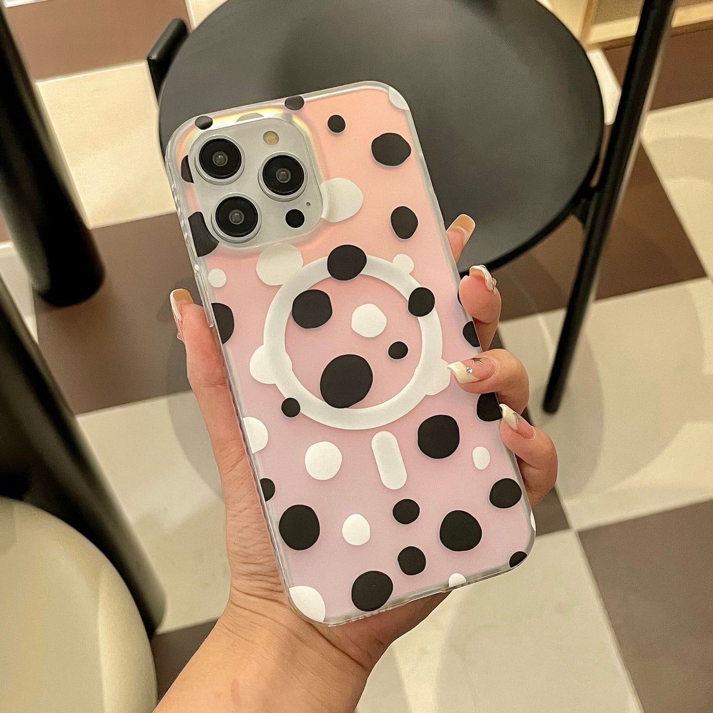 Magnetic phone case with cute polka dots design in pink and black for Apple devices.
