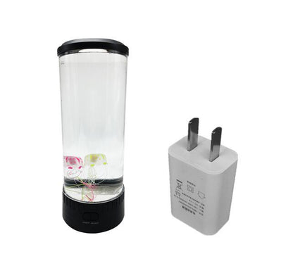 Jellyfish Light LED light in a cylindrical acrylic design with USB adapter, showcasing colorful jellyfish in water.