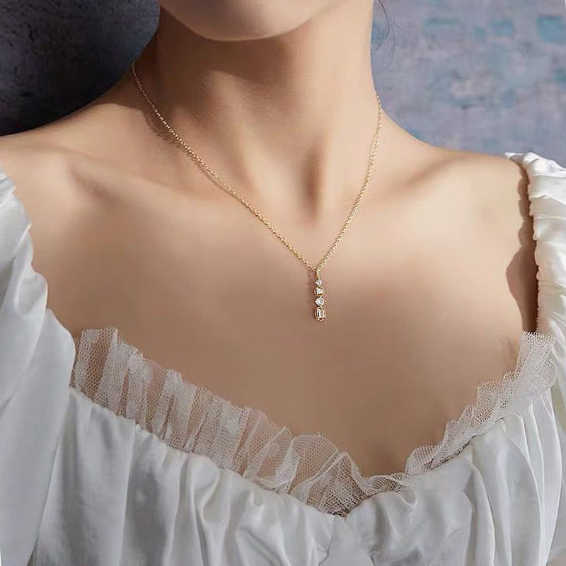 Necklace woman collarbone chain featuring a geometric personality pendant, elegantly showcased on a model.
