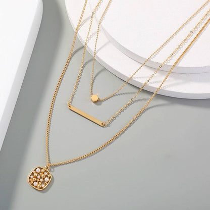 Elegant gold multi-layer necklace for women with unique pendant design