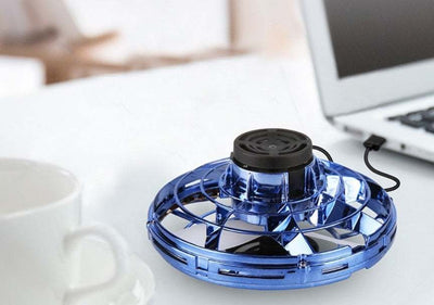 Mini fingertip gyro interactive flying toy drone in blue, USB rechargeable, desktop gadget for decompression and fun.