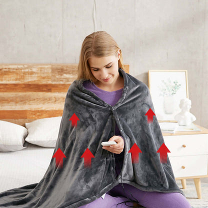 Person in a heated plush blanket using a phone, demonstrating comfort and warm features of Electric Heated Plush Blanket - Soft & USB Compatible.