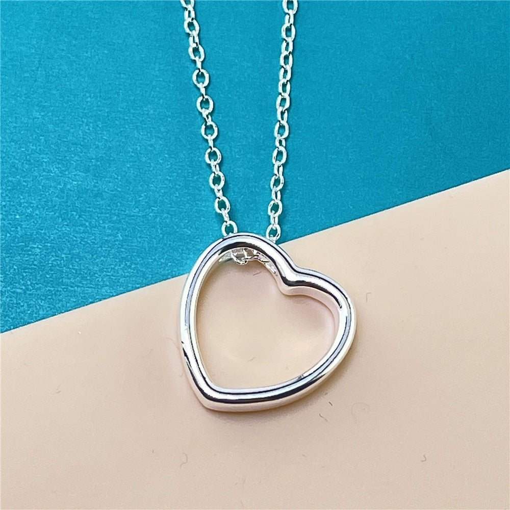 Heart Necklace for Women on a chain, showcasing a stylish heart design, perfect for modern and classic fashion.