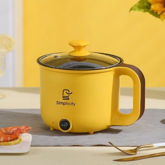 Household Electric Cooker Multifunctional Mini Smart Electric Caldron in vibrant yellow color with glass lid on a dining table.
