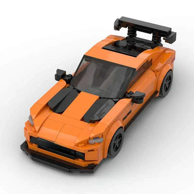 Orange LEGO-style Mercedes AMG GT model car kit with black racing stripes and rear spoiler