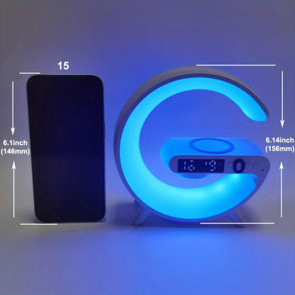 G shaped wireless charger stand with blue RGB night light and digital clock display next to smartphone showing size comparison