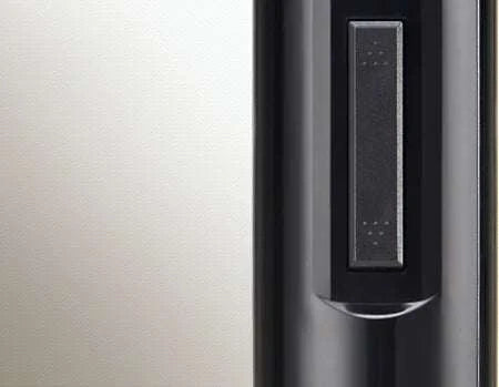 Close-up of black electric wine opener button on sleek ABS material body
