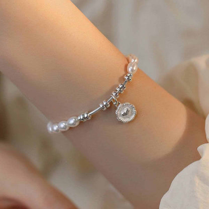 Fashion Love Pearl Necklace with silver love heart charm on wrist