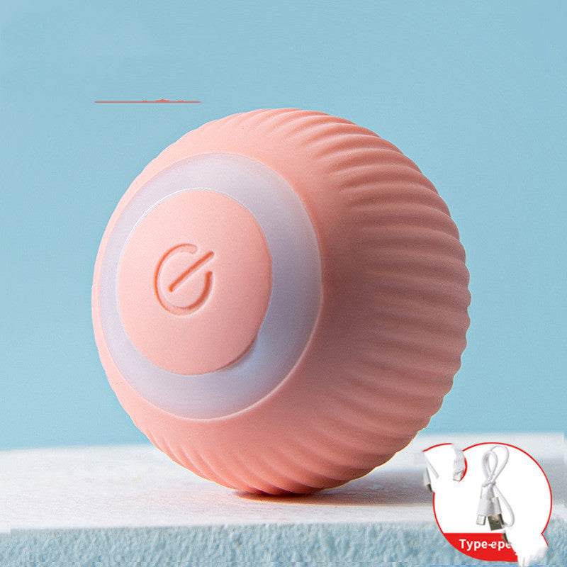 Pink rechargeable silicone pet rolling ball toy with power button and USB cable