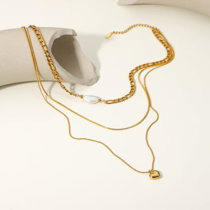 Elegant pearl heart-shaped necklace for women, featuring a lustrous pearl centerpiece and gold chain.
