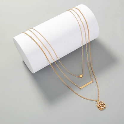 gold multi-layer necklace for women with unique pendant design