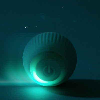 Blue rechargeable silicone rolling pet toy ball with glowing power button