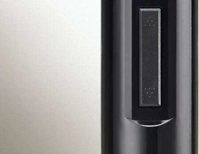 Black electric wine opener with modern minimalist design and button control